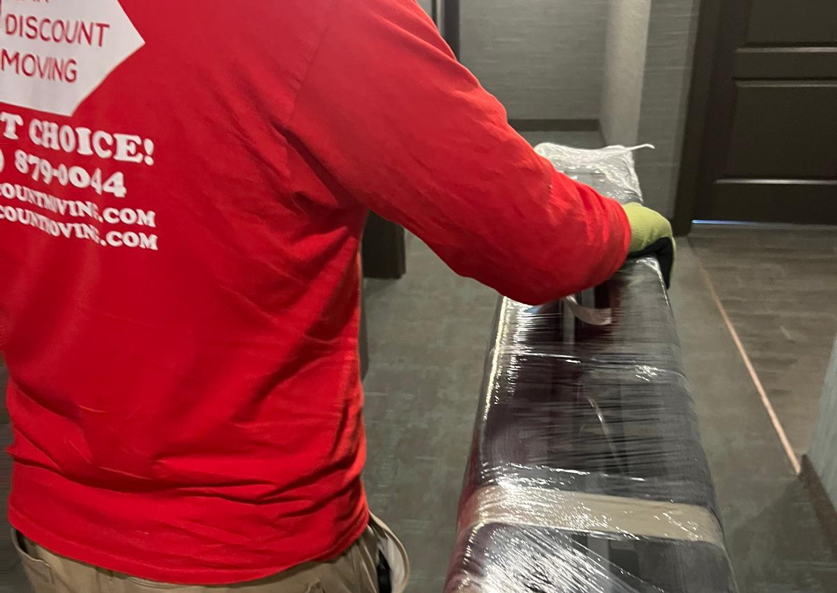moving company technician in Canada moving packed house items for moving. Carefully packing, preparing big and small things