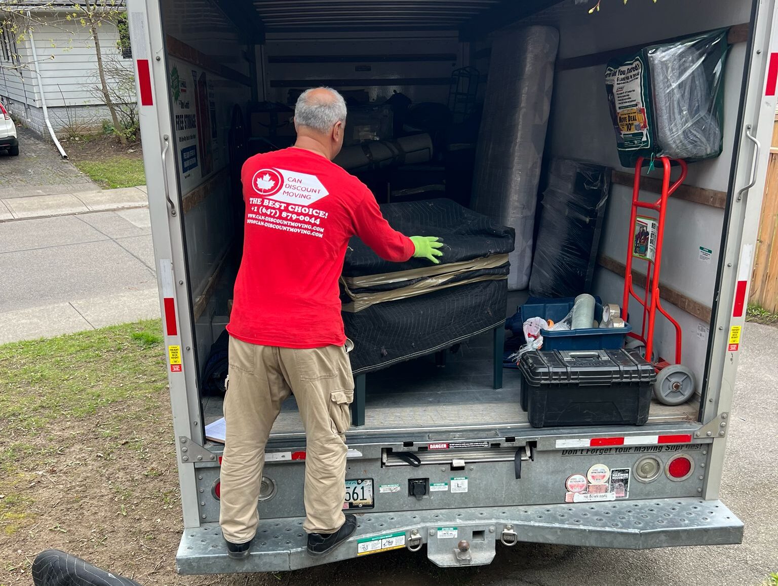 moving company packing all items to the truck and moving to another city.