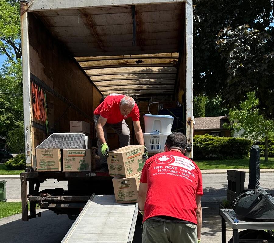 moving company truck getting filled with furniture and items for moving